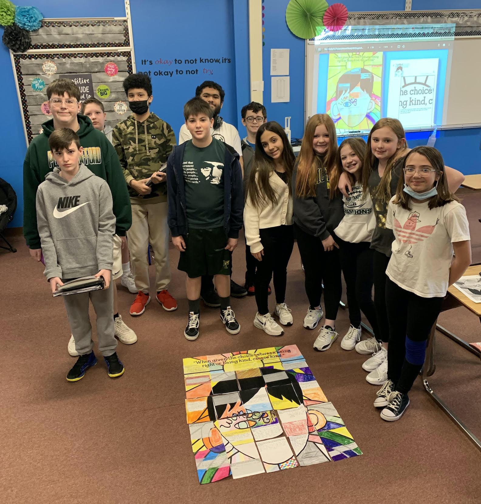 students with the completed puzzle