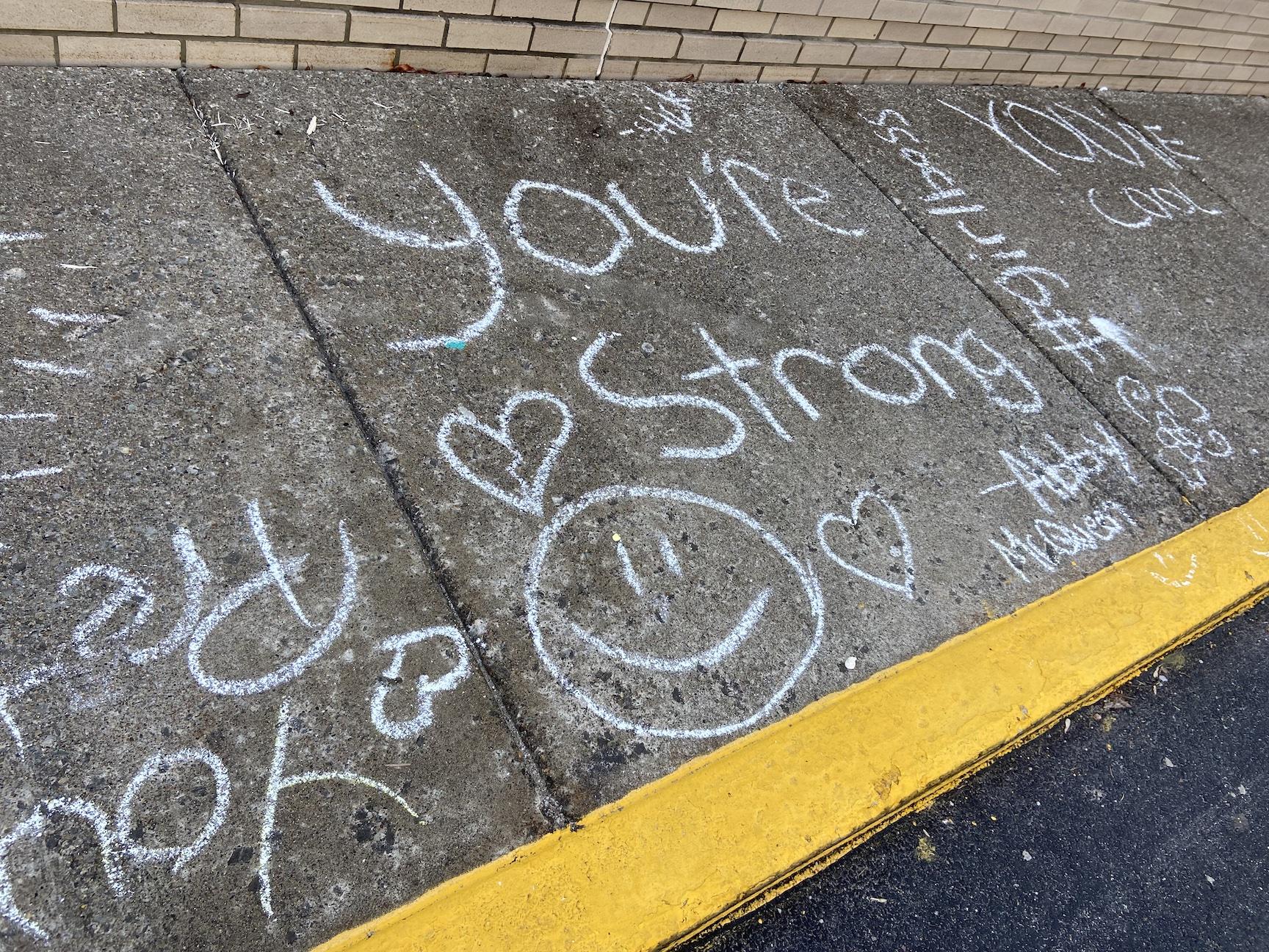 Students decorated the sidewalks with encouraging messages