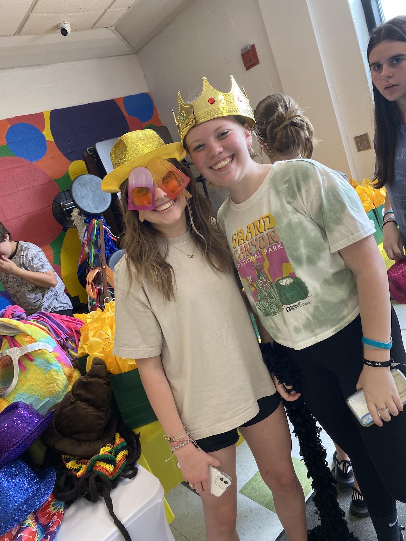 Brenna King and Avery Zeigler with some photo booth props
