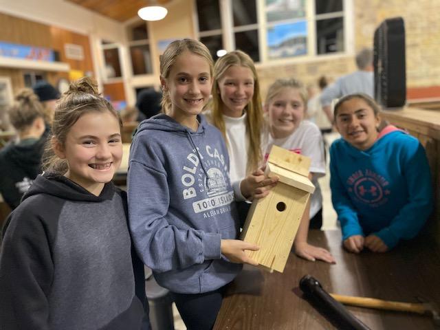 Gianna Sipe, Lilah Mrdjenovich,Taylor Gladkowski, Brynne Lawson, and Aria Smith show off the birdhouse they built together