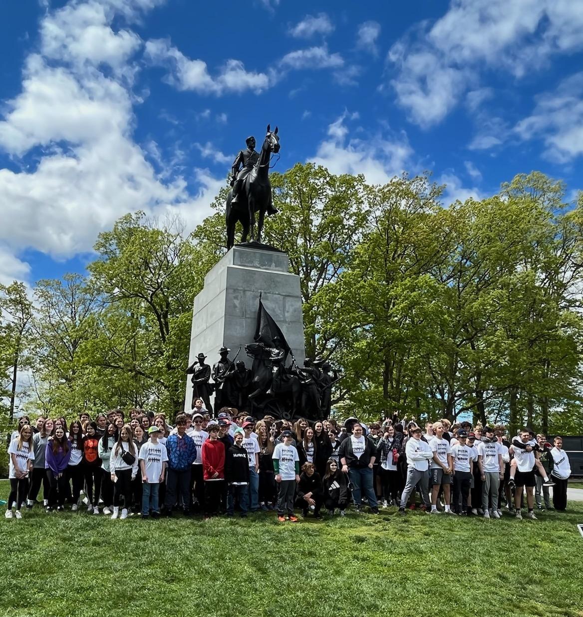 The Penn Middle School students gather at the Virginia Monument