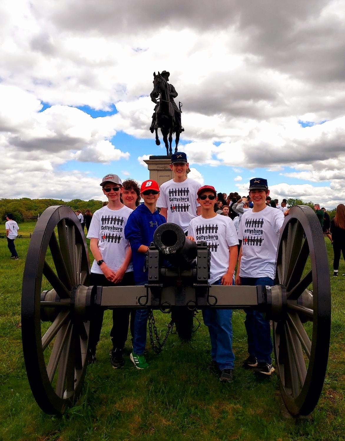 Penn Middle students Andy Baker, Josh Noble, Alex Haas, Collin Dransart, Scotty Clark, and Paul Pierce in front of the John Reynolds Monument