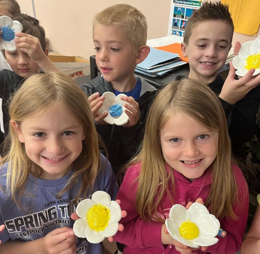 Sunrise Elementary 1st-graders (front) Tierney Rayburg, Madeline Balas, (back) Charles Nero, Christian Castma, and Beau Torrance display their flower bowls