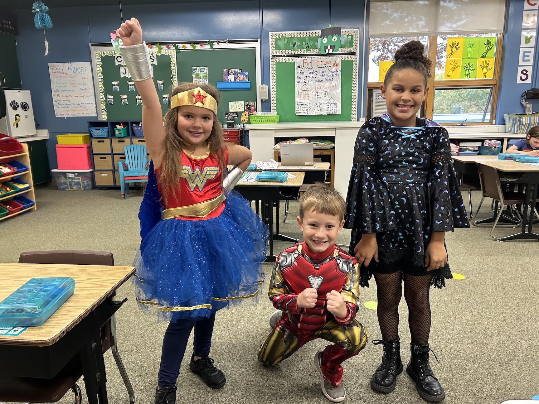 At Harrison Park Elementary, first-graders Samantha Younger, Owen Frontz, and Madison Laird showed ‘they have the power so say NO to drugs’ during Friday’s superhero day
