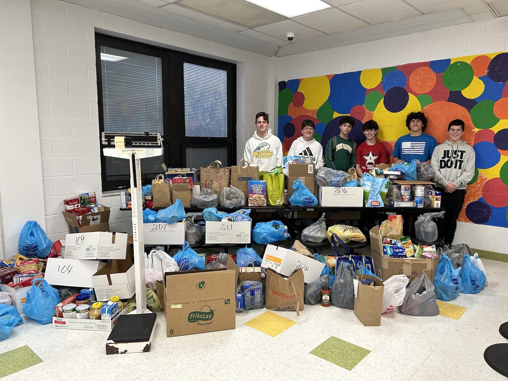Officers of the Penn Middle School Student Government weighed all the food donations:  (left to right) Nate Casey, Grady Swartz, Daniel Lisbon, Andrew Hauck, Tanner DeStefano, Braden Dynys